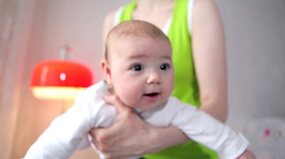 stock footage mother holding a baby in her arms